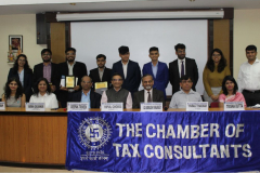 Group Photo of Judges & Winners. Sitting from L to R: CA Charmi A. Shah (Member), Ms. Varsha Galvankar (Chairperson), Shri Deepak Trivedi (Chief General Manager – SEBI), CA Vipul Choksi (President), CA Kamlesh Vikamsey, Mr. Parag Thakkar (I/C Principal) and Ms. Trisha Dutta (Prof.) H. R. College of Commerce & Economics.
